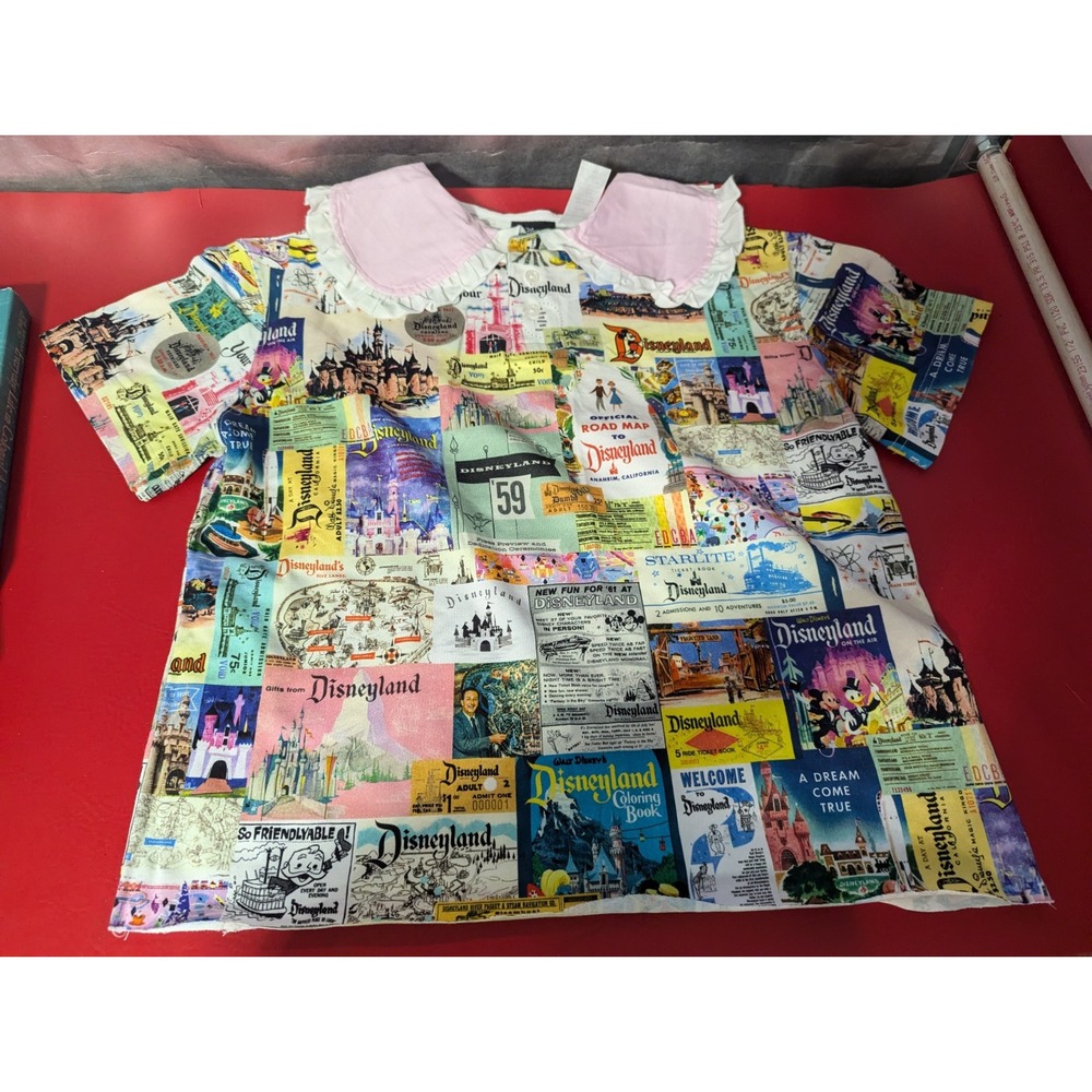 DISNEY 100 Womens XS ruffled collar shirt top Disneyland from around the world